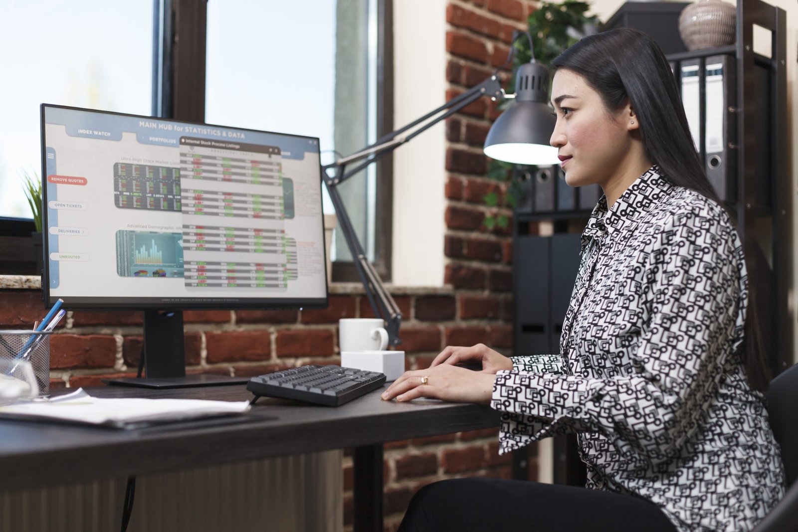 Research agency office worker analyzing organization financial data and statistics. Young confident company employee reviewing startup project status charts while sitting in modern office.